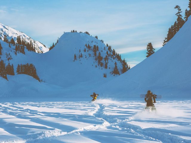 Dean Blotto Gray snowmobiling in the Whistler backcountry with Aaron Leyland