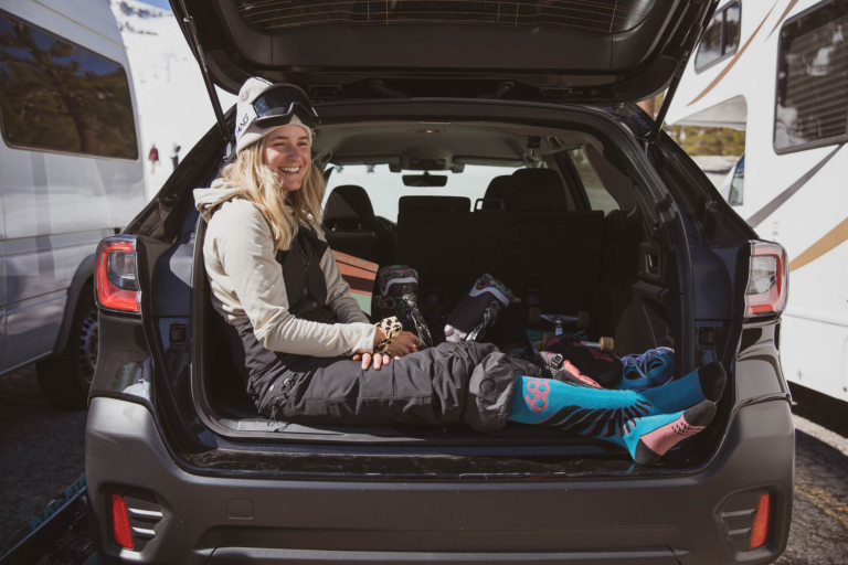 Taylor Elliott sits in a car after snowboarding