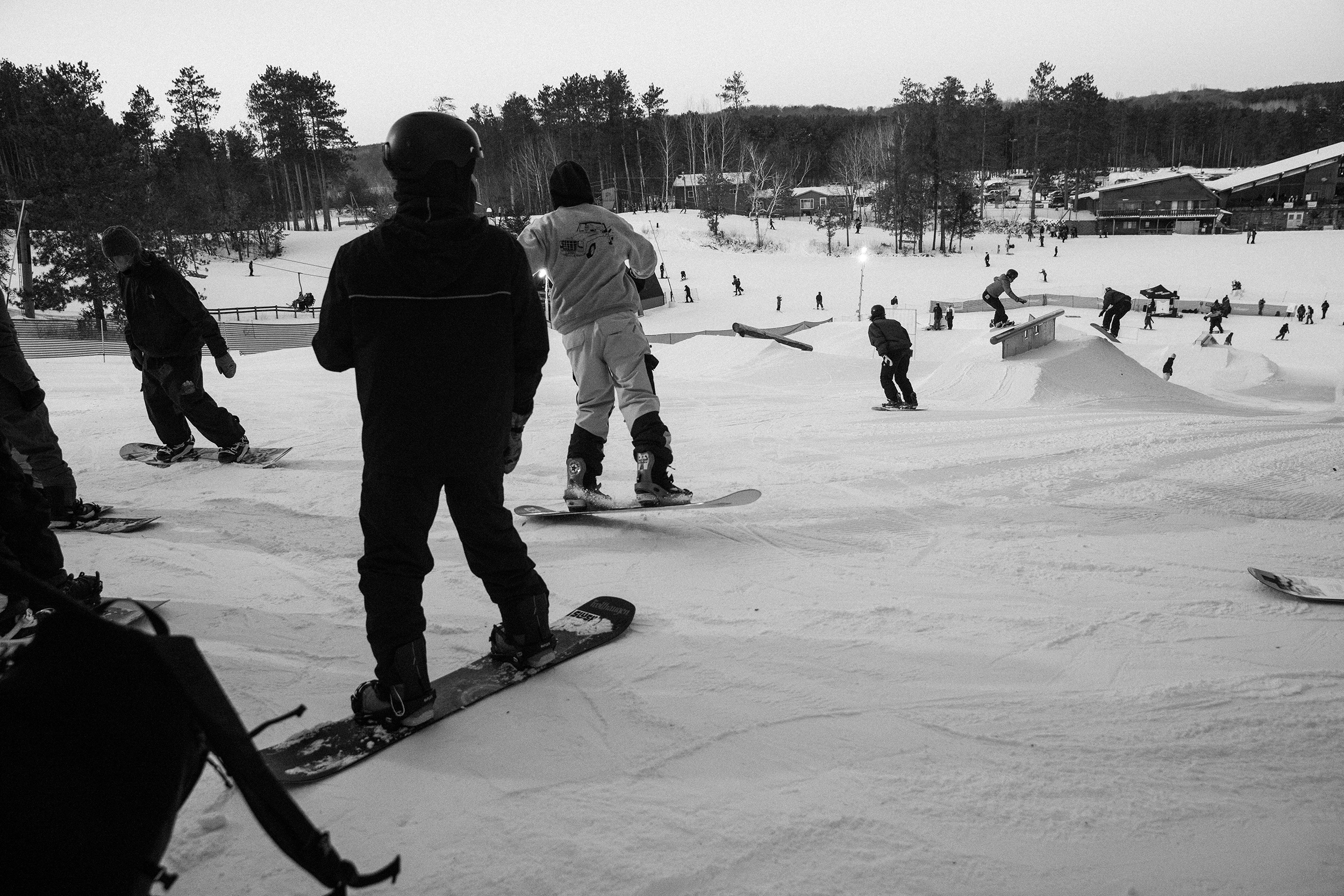 Riders warm up at Lord of the Ropes snowboard contest at Trollhaugen in Wisconsin